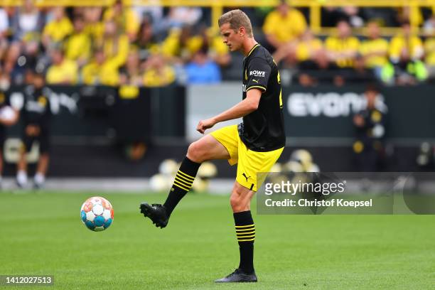 Sven Bender runs with the ball during a legend match during the season opening of Borussia Dortmund at Signal Iduna Park on July 31, 2022 in...