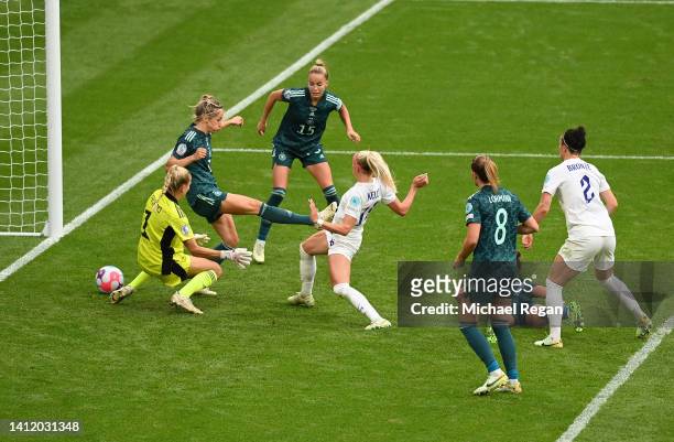 Chloe Kelly of England scores their side's second goal as Merle Frohms attempts to make a save and Kathrin-Julia Hendrich attempts to clear during...