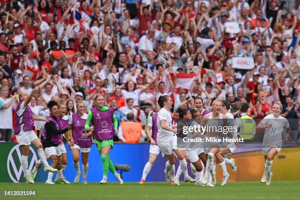 Players of England celebrate as Chloe Kelly of England celebrates scoring their side's second goal during the UEFA Women's Euro 2022 final match...
