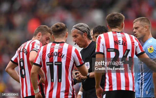 Referee Darren Bond wearing a hand band, makes a decision during the Sky Bet Championship between Sunderland and Coventry City at Stadium of Light on...