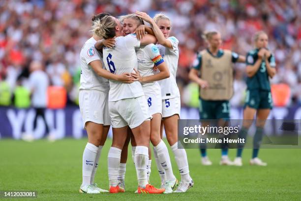 Millie Bright embraces Leah Williamson of England after the final whistle as England celebrates during the UEFA Women's Euro 2022 final match between...