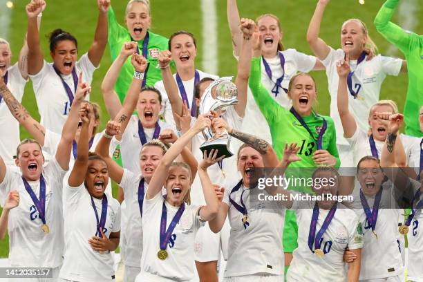 Leah Williamson of England lifts the UEFA Women’s EURO 2022 Trophy after their side’s victory during the UEFA Women's Euro 2022 final match between...