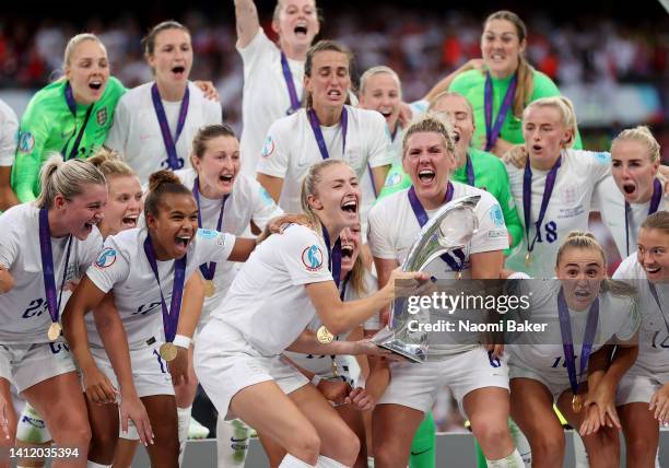 Leah Williamson and Millie Bright of England lift the UEFA Women’s EURO 2022 Trophy after their sides victory during the UEFA Women's Euro 2022 final...