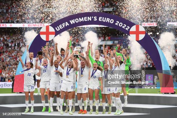 Leah Williamson and Millie Bright of England lifts the UEFA Women's EURO 2022 Trophy after their sides victory during the UEFA Women's Euro 2022...
