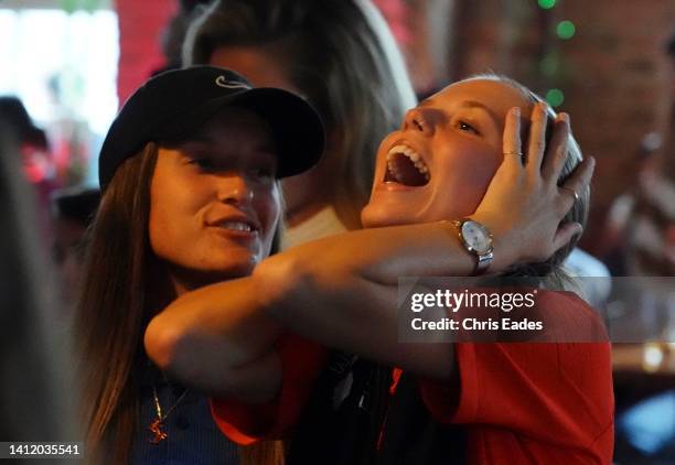 Fans celebrate at the Brighton Laines Pub as England win the Euro Women's cup final in extra time on July 31, 2022 in Brighton, England. England take...