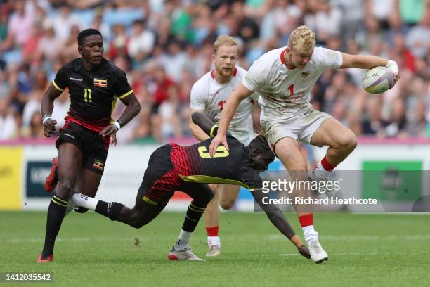 Jamie Adamson of Team England breaks away during Men's Rugby Sevens Playoff for 9th on day three of the Birmingham 2022 Commonwealth Games at...