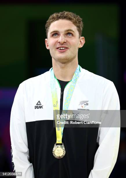 Gold medalist, Lewis Clareburt of Team New Zealand poses with their medal during the medal ceremony for the Men's 200m Butterfly Final on day three...