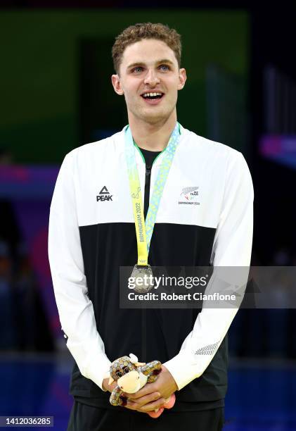 Gold medalist, Lewis Clareburt of Team New Zealand poses with their medal during the medal ceremony for the Men's 200m Butterfly Final on day three...