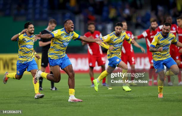 Players of Eintracht Braunschweig celebrate after the penalty shoot out during the DFB Cup first round match between Eintracht Braunschweig and...