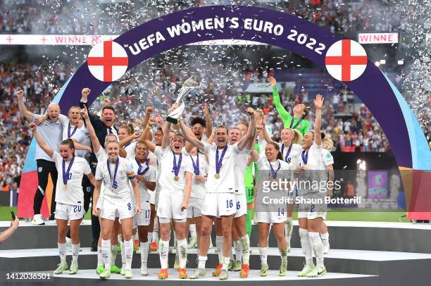 Ellen White and Jill Scott of England lift the UEFA Women's EURO 2022 Trophy after their side's victory during the UEFA Women's Euro 2022 final match...
