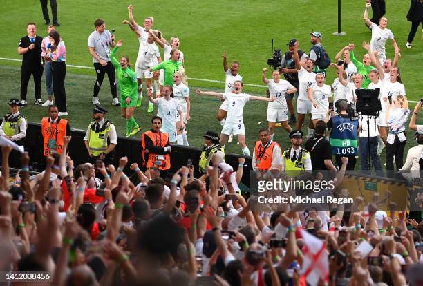 Players of England celebrate in front of their fans after the final whistle of the UEFA Women's Euro 2022 final match between England and Germany at...