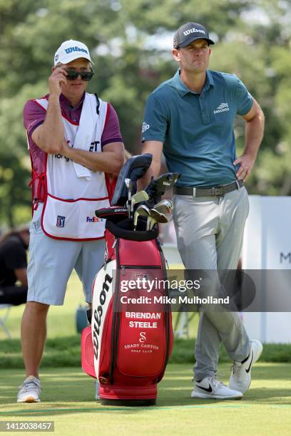 Brendan Steele of the United States and his caddie look on from the ninth tee during the final round of the Rocket Mortgage Classic at Detroit Golf...