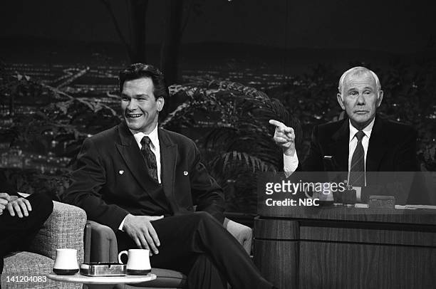 Air Date -- Pictured: Actor Patrick Swayze, host Johnny Carson -- Photo by: Gary Null/NBCU Photo Bank