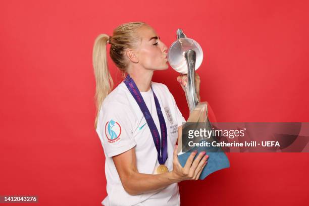 Alex Greenwood of England celebrates with the UEFA Women’s EURO 2022 Trophy during a post match photoshoot after their side's victory during the UEFA...