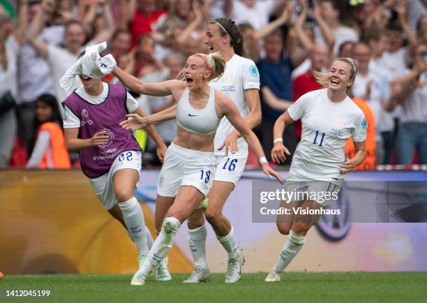 Chloe Kelly of England celebrates scoring the winning goal with team mates Lotte Wubben-Moy, Jill Scott and Lauren Hemp during the UEFA Women's Euro...