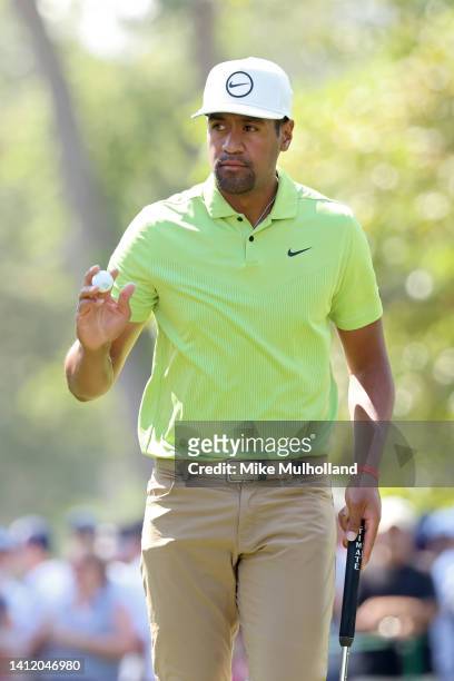 Tony Finau of the United States reacts after making par on the ninth green during the final round of the Rocket Mortgage Classic at Detroit Golf Club...