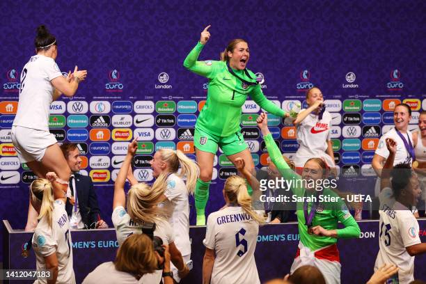 Lucy Bronze and Mary Earps dance on the Press Conference table as players of England interrupt the Press Conference with Sarina Wiegman, Manager of...