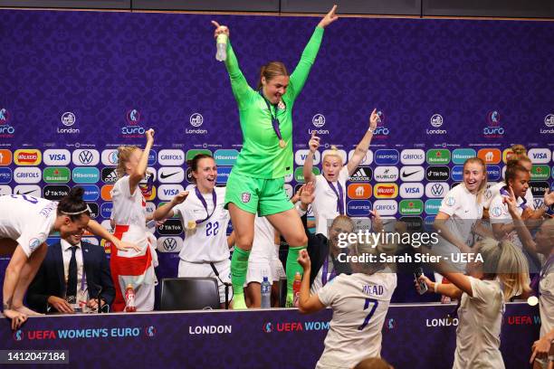 Mary Earps dance on the Press Conference table as players of England interrupt the Press Conference with Sarina Wiegman, Manager of England, after...