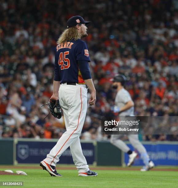 Ryne Stanek of the Houston Astros gives up a two run home run to Jesse Winker of the Seattle Mariners is the eighth inning at Minute Maid Park on...