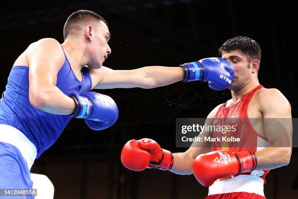 Callum Peters of Team Australia and Sumit of Team India fight in the men’s Over 71kg-75kg round 16 bout of the boxing on day three of the Birmingham...