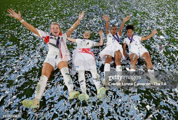 Lauren Hemp, Lucy Bronze, Nikita Parris and Demi Stokes of England celebrate following the UEFA Women's Euro 2022 final match between England and...