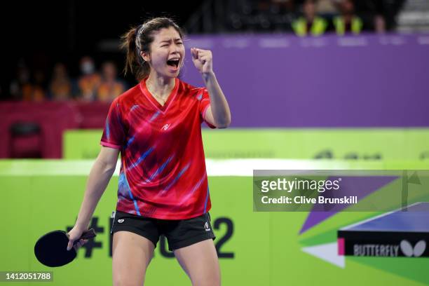 Ying Ho of Team Malaysia celebrates winning match point against Charlotte Carey of Team Wales during the Women's Table Tennis Team Semi-Final match...