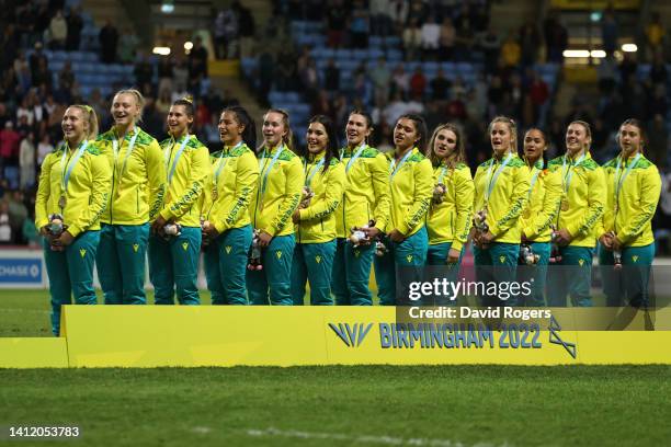 Gold Medalists, Team Australia sing their national anthem during the Rugby Sevens Women's medal ceremony on day three of the Birmingham 2022...