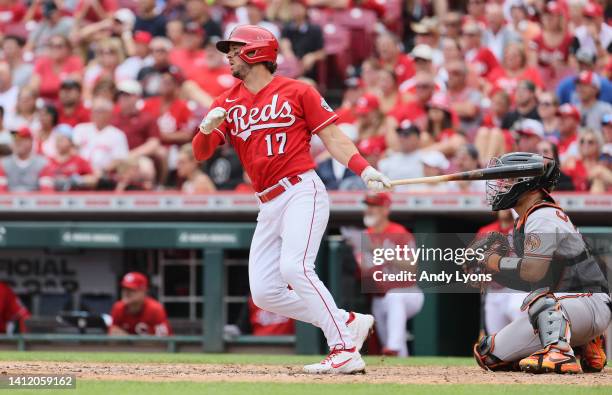 Kyle Farmer of the Cincinnati Reds hits a RBI sacrifice fly in the 6th inning during the game against the Baltimore Orioles at Great American Ball...