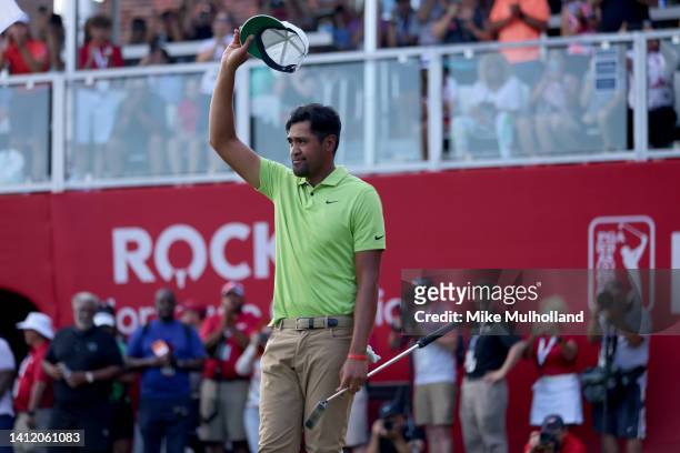 Tony Finau of the United States celebrates on the 18th green after winning the Rocket Mortgage Classic at Detroit Golf Club on July 31, 2022 in...