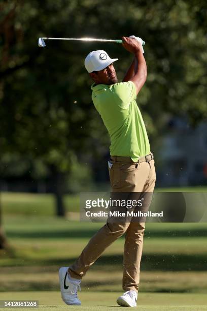 Tony Finau of the United States plays his shot on the 17th hole during the final round of the Rocket Mortgage Classic at Detroit Golf Club on July...