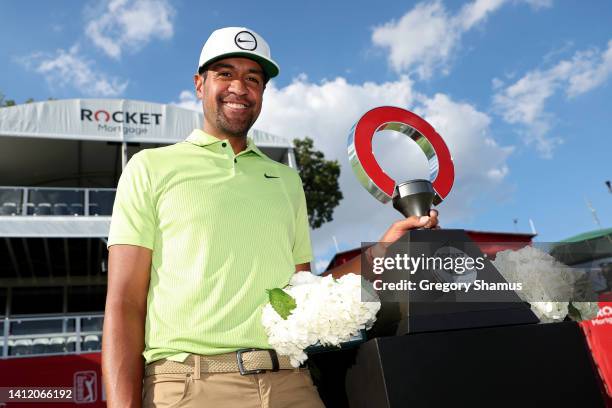 Tony Finau of the United States poses with the trophy after winning the Rocket Mortgage Classic at Detroit Golf Club on July 31, 2022 in Detroit,...