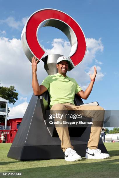 Tony Finau of the United States poses for photos after winning the Rocket Mortgage Classic at Detroit Golf Club on July 31, 2022 in Detroit, Michigan.