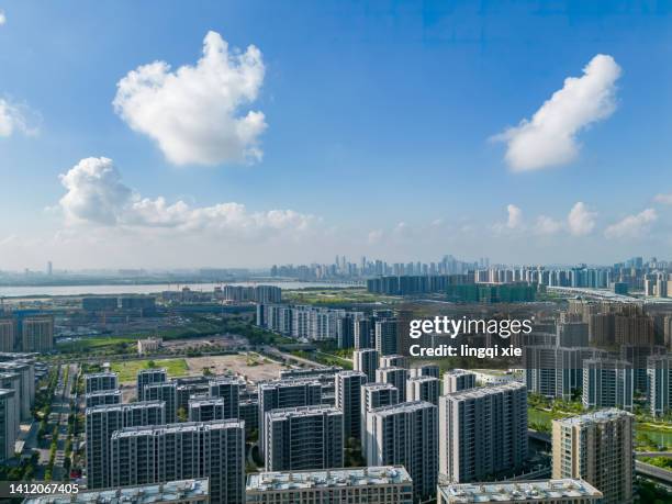 hangzhou, china, city under blue sky and white clouds - doha sunset stock pictures, royalty-free photos & images