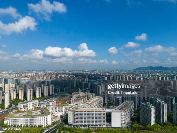 hangzhou, china, city under blue sky and white clouds - hangzhou bildbanksfoton och bilder