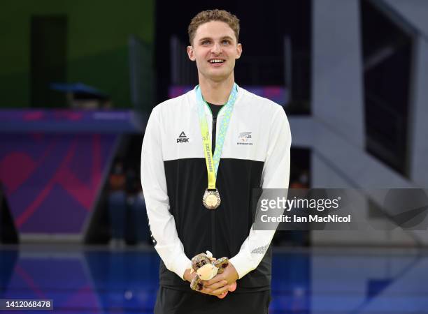 Lewis Clareburt of Team New Zealand is seen with his gold medal from the final of the Men's 200m Butterfly on day three of the Birmingham 2022...