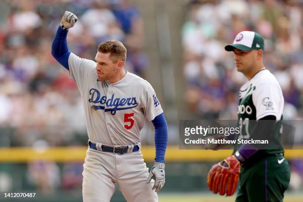 Freddie Freeman of the Los Angeles Dodgers gestures on second base after hitting a RBI double against the Colorado Rockies in the seventh inning at...