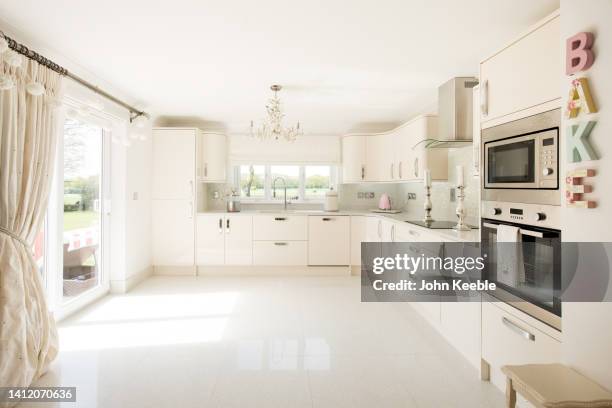 property kitchen interiors - beige curtains stock pictures, royalty-free photos & images