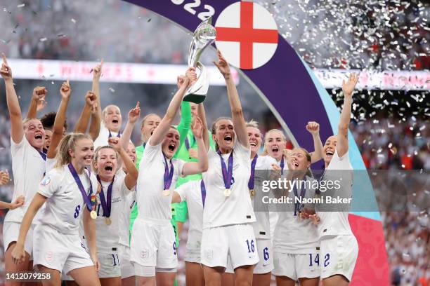 Ellen White and Jill Scott of England lift the trophy during the UEFA Women's Euro 2022 final match between England and Germany at Wembley Stadium on...