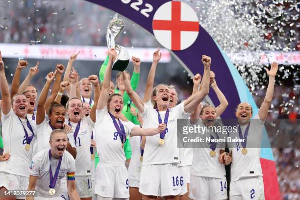 Ellen White and Jill Scott of England lift the trophy during the UEFA Women's Euro 2022 final match between England and Germany at Wembley Stadium on...