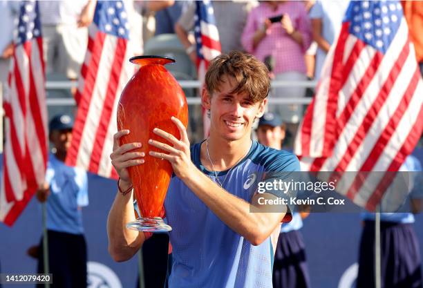 Alex de Minaur of Australia poses with the trophy after defeating Jenson Brooksby in the singles final of the Atlanta Open at Atlantic Station on...