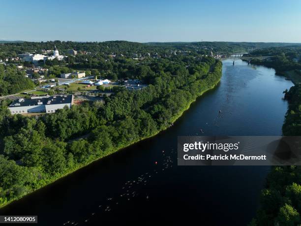 An aerial view shows age group athletes compete on the swim course during IRONMAN 70.3 Maine on July 31, 2022 in Augusta, Maine.