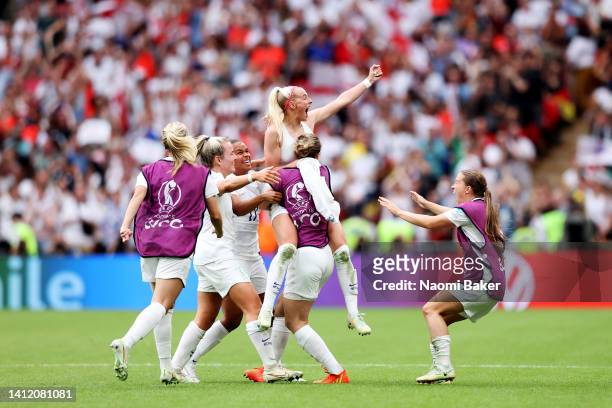 Chloe Kelly of England celebrates with her team after scoring her sides second goal during the UEFA Women's Euro 2022 final match between England and...