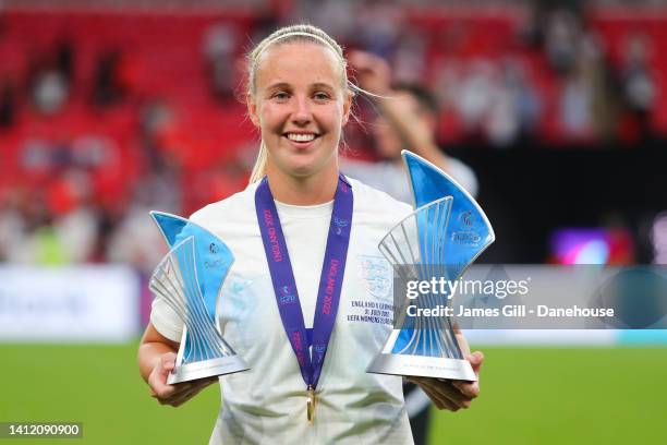 Beth Mead of England celebrates with the Player of the Tournament and Golden Boot trophies following the UEFA Women's Euro England 2022 final match...