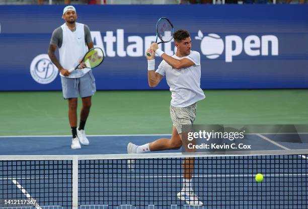 Thanasi Kokkinakis of Australia returns a backhand to Jason Kubler of Australia and John Peers of Australia during the doubles final at the Atlanta...