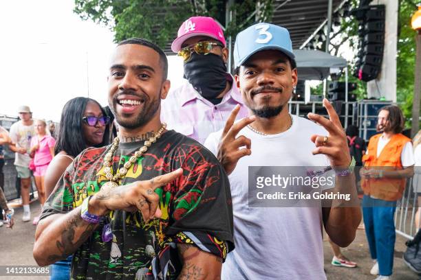 Vic Mensa and Chance The Rapper pose for a photo backstage during 2022 Lollapalooza at Grant Park on July 31, 2022 in Chicago, Illinois.