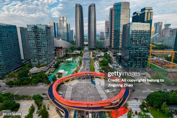 overlooking the circular overpass and twin tower skyscrapers of new downtown in chengdu - chengdu stock-fotos und bilder