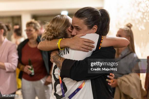 Laura Freigang of Germany hugs Dzsenifer Marozsan during a banquet for the Germany Women's National Team following the loss of the UEFA Women's EURO...