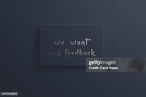 we want your feedback paper  whith casting shadows.deep blue background - we want your feedback stock pictures, royalty-free photos & images