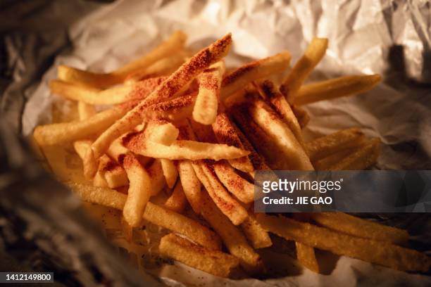 french fries - chips on paper stock pictures, royalty-free photos & images