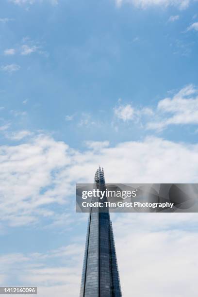 top section of the shard tower, london, uk - guglia foto e immagini stock